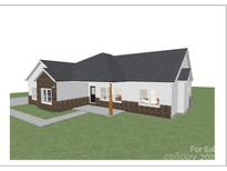 Modern farmhouse exterior with brick and siding at 1569 E Ridge Rd, Salisbury, NC 28144