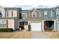 Charming townhome featuring a one-car garage, well-maintained landscaping, and neutral color palette at 268 River Clay Rd, Fort Mill, SC 29708