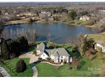 Luxury home on lakefront lot with pool and expansive grounds at 424 Fairhaven Ct, Waxhaw, NC 28173