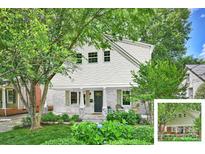 Charming two-story home featuring white siding, brick accents, inviting front porch, and a beautifully landscaped front yard at 741 Mcalway Rd, Charlotte, NC 28211