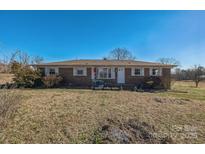 Brick ranch house with a large yard at 2829 Long Cir, Iron Station, NC 28080