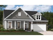 Attractive craftsman style home with gray siding and stone accents at 4002 Grace Pointe Dr # 106, Indian Trail, NC 28079