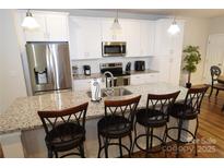 Modern kitchen with stainless steel appliances and granite countertops at 1028 Sharon Towns Dr, Charlotte, NC 28210