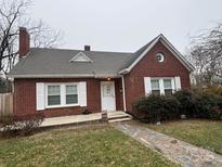 Brick house with a gray roof, walkway, and landscaping at 168 Park St, Statesville, NC 28677