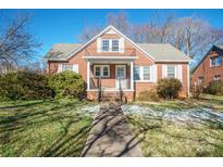 Brick house with white shutters, front porch, and walkway at 168 Park St, Statesville, NC 28677
