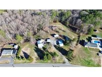 Aerial view of property showing house, detached garage and large lot at 326 Stanley Spencer Mtn Rd, Gastonia, NC 28056