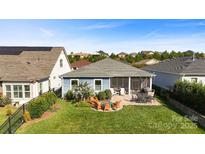 Spacious backyard with patio, screened porch and landscape at 5002 Looking Glass Trl, Denver, NC 28037