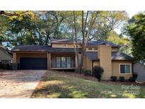 Attractive exterior of a two-story house with a covered carport and landscaping at 1213 Jules Ct, Charlotte, NC 28226