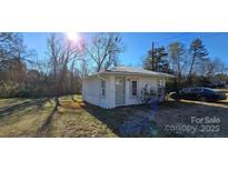 Charming cottage with freshly painted exterior and spacious yard at 153 Saluda St, Chester, SC 29706