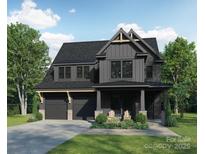 Two-story modern farmhouse with gray siding, attached garage, and landscaping at 2633 Ritz Ln, Matthews, NC 28105