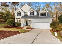 Two-story house with gray siding, two-car garage, and landscaping at 3512 Conway Ct, Fort Mill, SC 29715