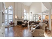 Spacious living room with fireplace and high ceilings at 117 Biscayne Ct, Mooresville, NC 28117