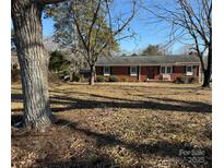 Brick ranch house with a large yard at 1217 Burke Rd, Shelby, NC 28152