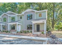 New townhome development with inviting landscaping and brick accents at 1754 J Julian Ln, Charlotte, NC 28208