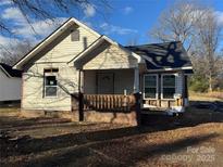 Fixer-upper home with front porch and large yard at 328 Whitner St, Rock Hill, SC 29730