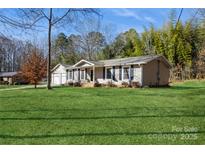 Ranch home with attached garage and spacious lawn at 3705 Pinecrest Dr, Gastonia, NC 28056