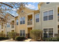 Inviting townhome exterior boasts charming architectural details and landscaping at 4126 Walker Rd, Charlotte, NC 28211