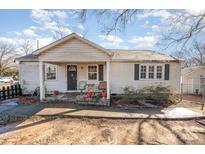 Ranch style home with covered porch and mature trees at 6208 Karenstone Dr, Charlotte, NC 28215