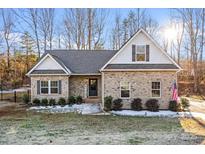 Brick house with gray roof and American flag at 3229 Creek Bend Ct, Sherrills Ford, NC 28673