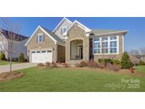 Attractive two-story home with stone exterior and landscaping at 45528 Misty Bluff Dr, Charlotte, NC 28278