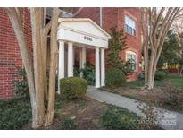 Brick building exterior with columns and landscaping at 5601 Fairview Rd # 22, Charlotte, NC 28209