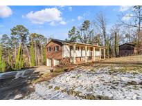 Brick ranch home with attached garage and landscaped yard at 261 Skyline Rd, Hickory, NC 28601