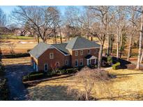 Brick house with attached garage; large backyard and golf course view at 3467 Rock Bridge Dr, Conover, NC 28613