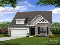 Craftsman style home with stone accents and a two-car garage at 4003 Grace Pointe Dr # 99, Wesley Chapel, NC 28079