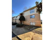 Brick building exterior with landscaping and sidewalk at 4822 Spring Lake Dr # D, Charlotte, NC 28212