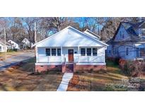 Charming craftsman style home with a front porch and walkway at 520 W 5Th Ave, Gastonia, NC 28052