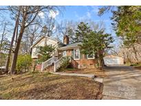 Attractive two-story house featuring a brick facade and a well-maintained lawn at 7401 Kilcullen Dr, Charlotte, NC 28270