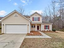 Two-story house with attached garage and landscaped front yard at 2154 Pheasant Glen Rd, Charlotte, NC 28214