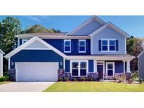 Two-story home with blue siding, white trim, and a landscaped lawn at 242 Winford Rd, Troutman, NC 28116