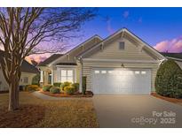 Attractive exterior of a one-story home with a two-car garage at 1024 Knob Creek Ln, Tega Cay, SC 29708