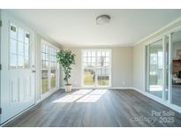 Bright, airy living room featuring hardwood floors and large windows, creating a welcoming atmosphere at 3416 Polkville Rd, Shelby, NC 28150