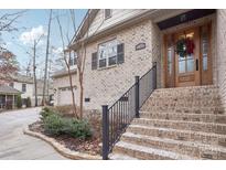 Brick home with a charming front porch and walkway at 12 Tanglewood Rd, Clover, SC 29710