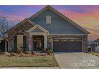 Inviting ranch home with stone accents and a two-car garage at 1608 Traditions Ct, Waxhaw, NC 28173