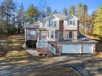 Brick house with two-car garage and a white front door at 5774 Crown Ter, Hickory, NC 28601