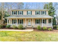 Charming two-story home with a welcoming covered front porch and beautifully landscaped yard at 761 Summerwood Dr, Rock Hill, SC 29732