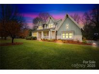 Two-story craftsman style home with a welcoming front porch at 832 Heather Ln, Charlotte, NC 28209