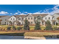 Townhouses with inviting front yards and landscaping at 9835 Old Garden Cir, Gastonia, NC 28056