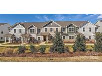 Townhouse exterior boasts a modern design and landscaping at 9839 Old Garden Cir, Gastonia, NC 28056