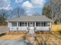 Charming craftsman style home with front porch and landscaped yard at 2328 Sanders Ave, Charlotte, NC 28216