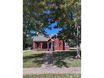 Brick home with a landscaped lawn and inviting front porch at 300 S Thompson St, Shelby, NC 28150