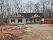 Charming single-story home featuring stone accents and a well-manicured yard at 625 Shiloh Unity Rd, Lancaster, SC 29720