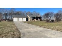 Ranch home with three-car garage and long driveway at 250 Bost Rd, China Grove, NC 28023