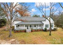 Charming farmhouse with wrap-around porch and large yard at 2633 Jb Denton Rd, Lancaster, SC 29720