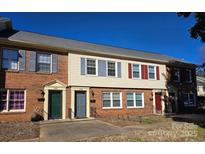 Brick front of a charming condo building with multiple units at 4618 Old Lantern Way, Charlotte, NC 28212