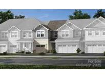 Modern home exterior with attached garage and inviting curb appeal at 12209 Gambrell Dr # 70, Charlotte, NC 28278