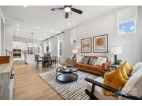 Open living space with leather couch and large windows at 3103 Beacon Heights Rd, Indian Land, SC 29707